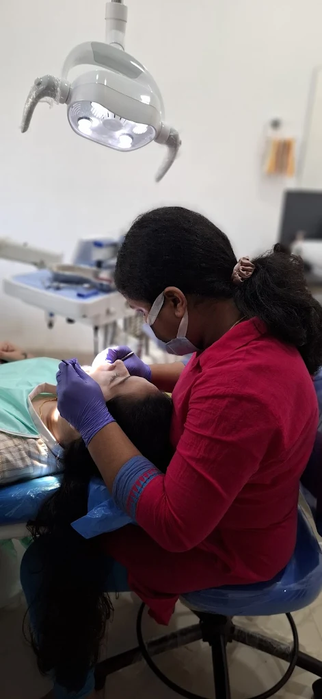 A dental professional caring for a patient